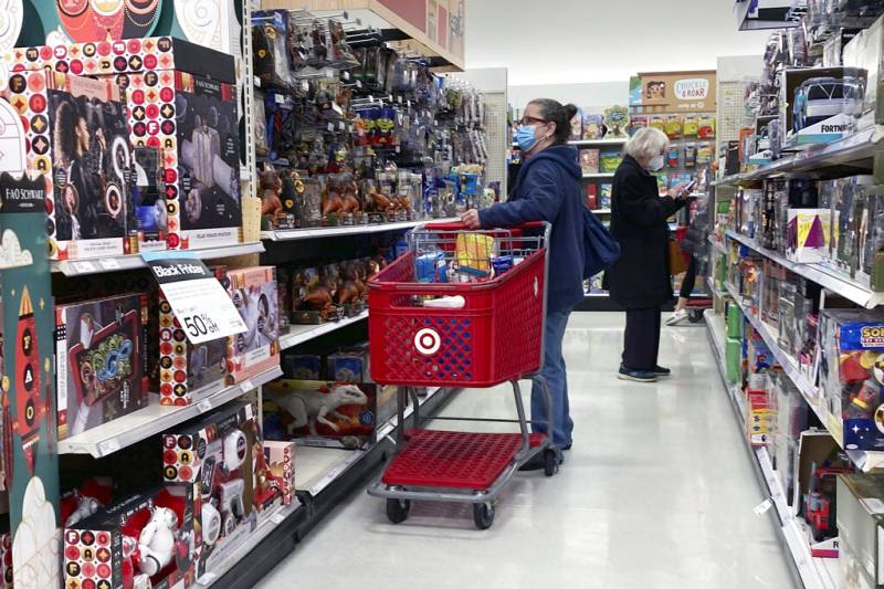 FILE - People shop at a Target store in Clifton, New Jersey, on Monday, Nov. 22,
2021. The nation’s two major retailers _ Walmart and Target_ plan to push
deals and other marketing gimmicks for the holiday shopping season earlier than
last year as soaring inflation spurs customers to get a jump start on gift... FILE - People shop at a Target store in Clifton, New Jersey, on Monday, Nov. 22,
2021. The nation’s two major retailers _ Walmart and Target_ plan to push
deals and other marketing gimmicks for the holiday shopping season earlier than
last year as soaring inflation spurs customers to get a jump start on gift...