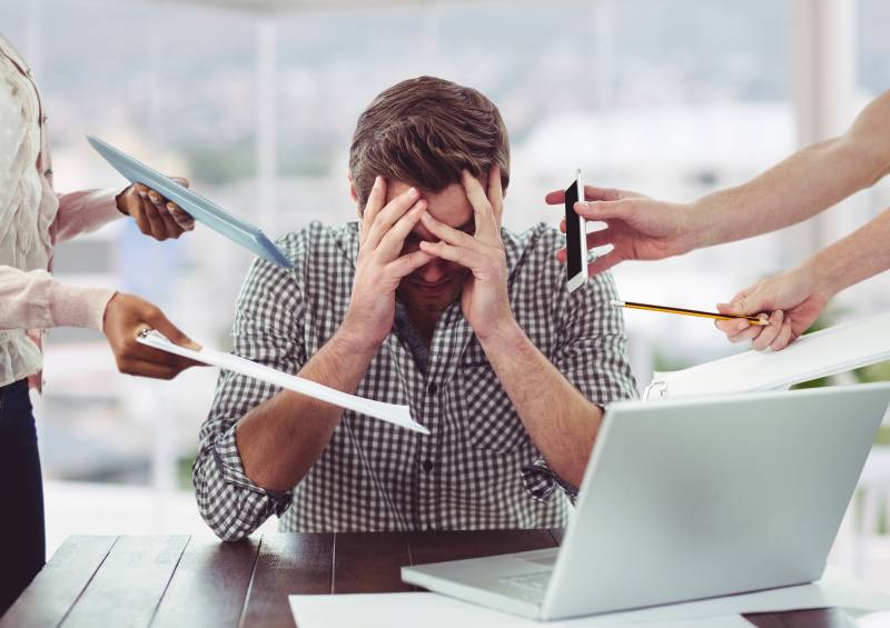 Stressed man frustrated with electronic devices Stressed man frustrated with electronic devices